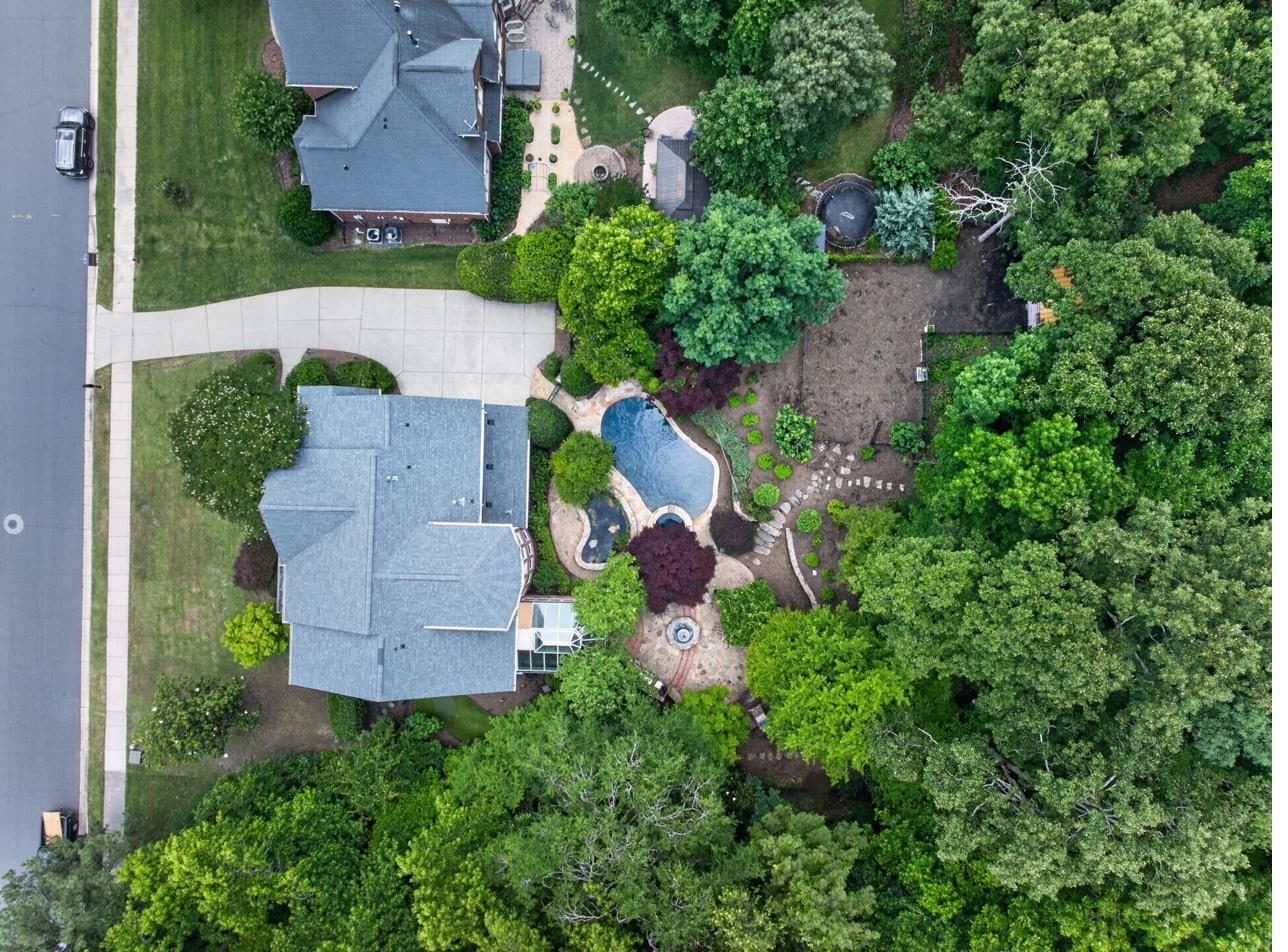 Aerial view of the 1.26-acre two-parcel compound at 7810 Stonehaven Drive
