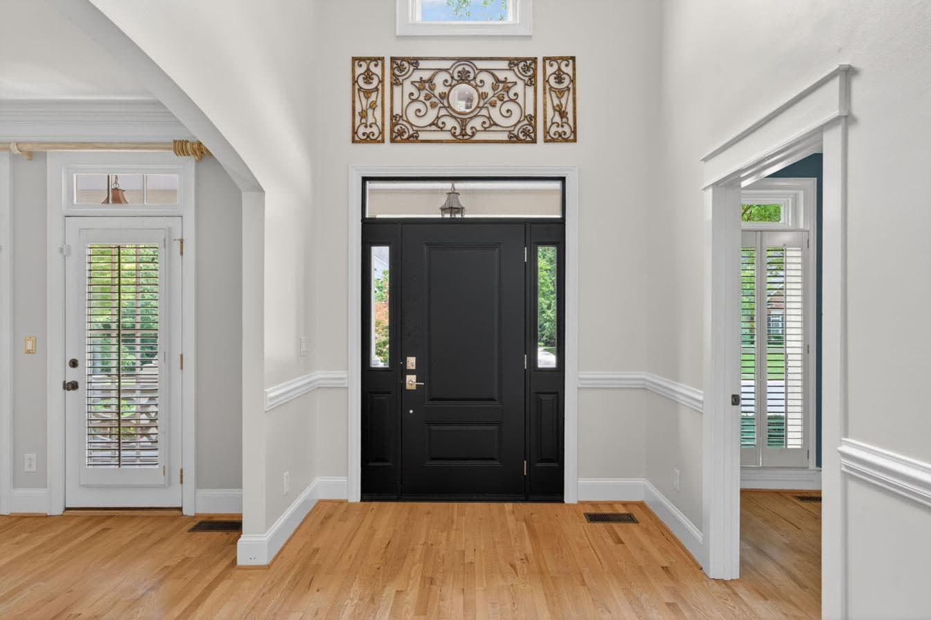 Renewed grand entry with natural light through new fenestration